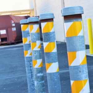 Safety pipes for loading and unloading tractor trailers in docking station.